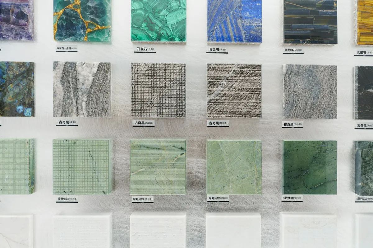 Stone and tile samples set out on a display board