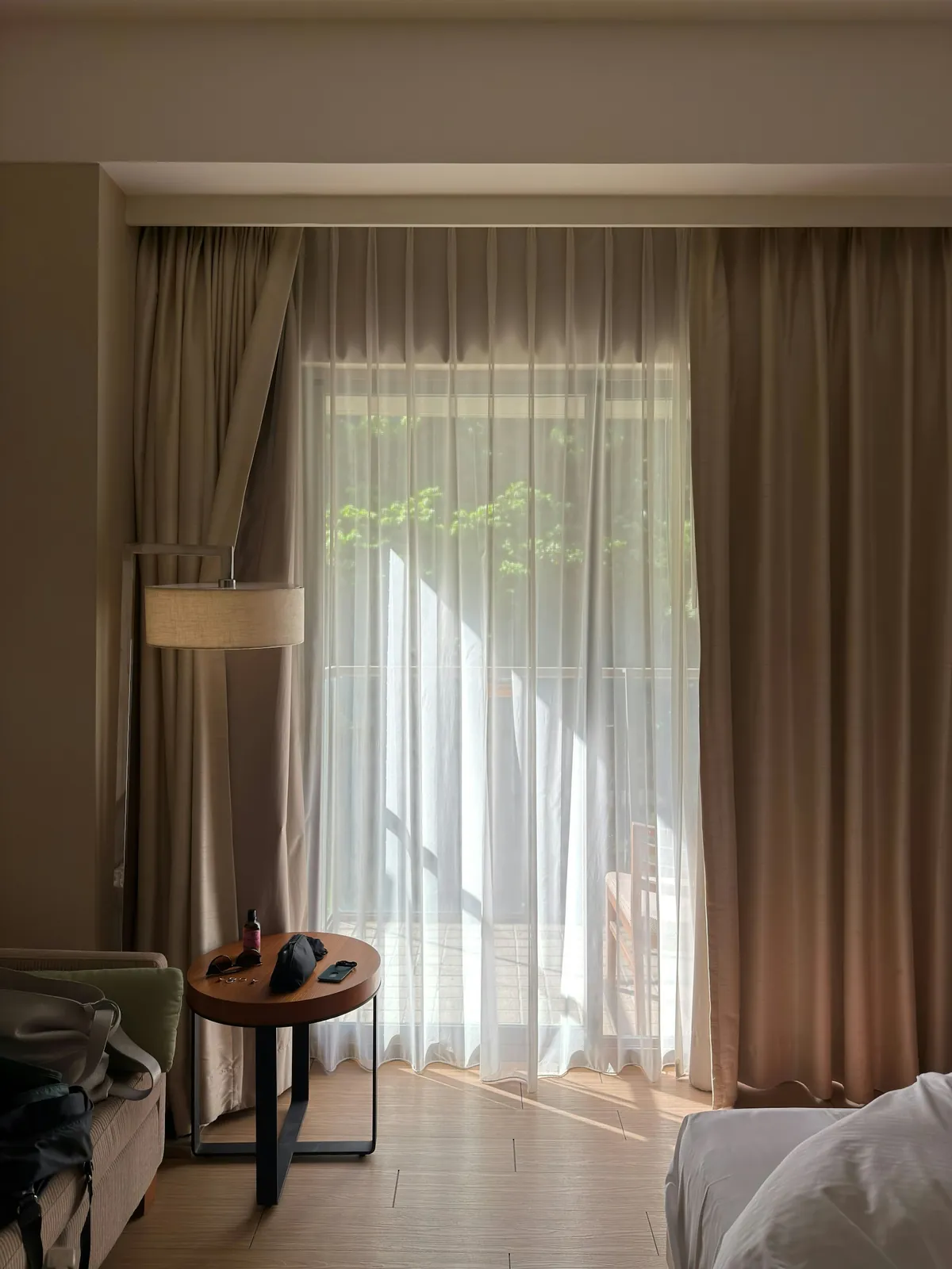 Sheer curtains with heavier side panels at a sunny window